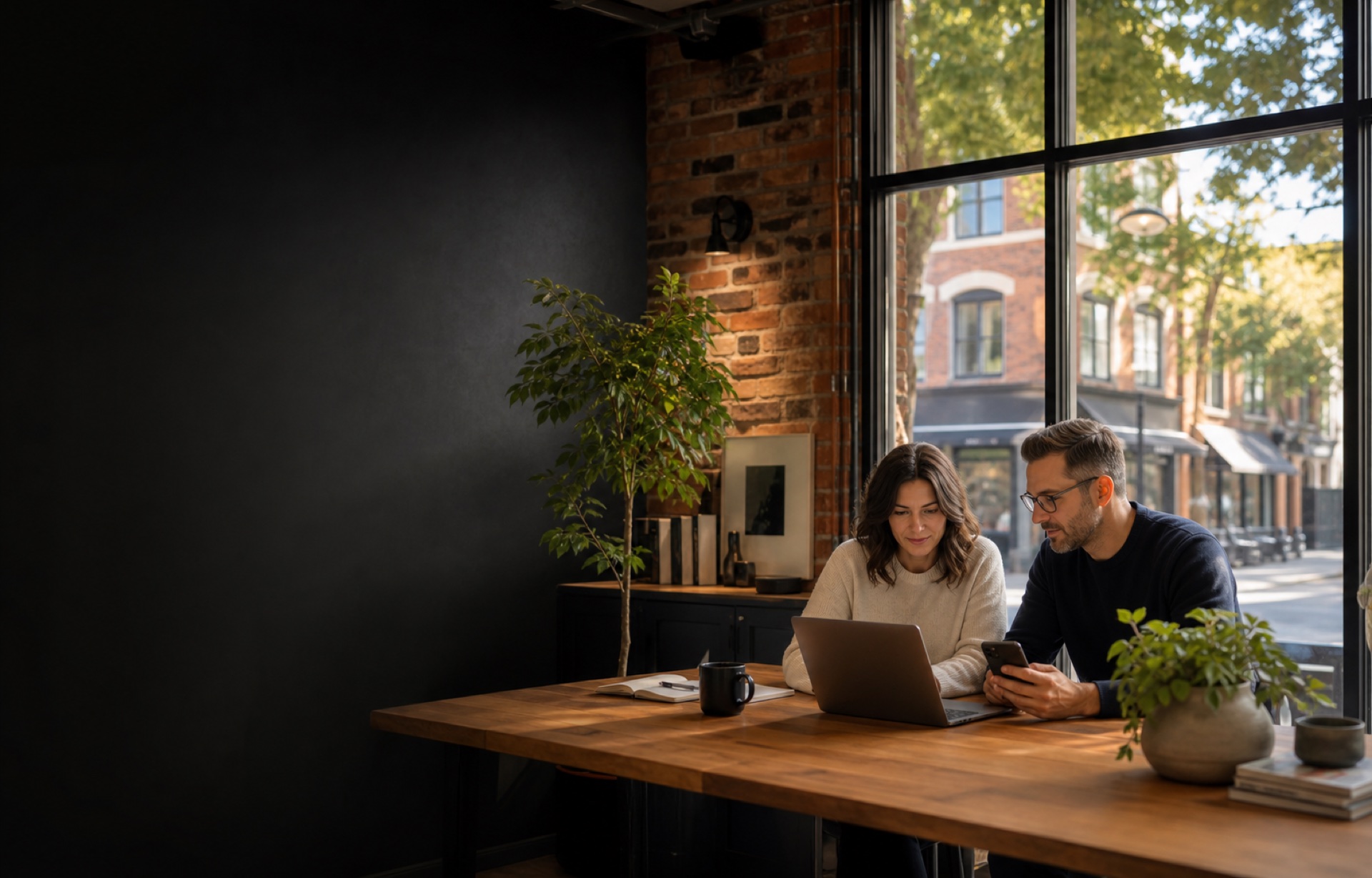 Southern Ontario business owners reviewing their website in a polished local workspace